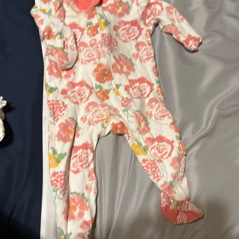 Burt’s Bee onesie 0-3 mo. Baby girl with grippers for feet, and closed hands